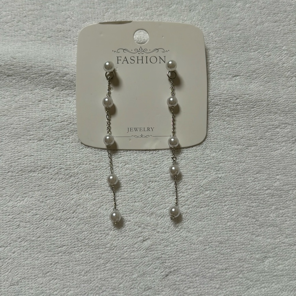 Faux pearl dangly earrings.